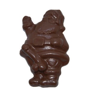 Schokoladen-Santa mit bösem Blick und Waffe, aus Schokolade gefertigt.